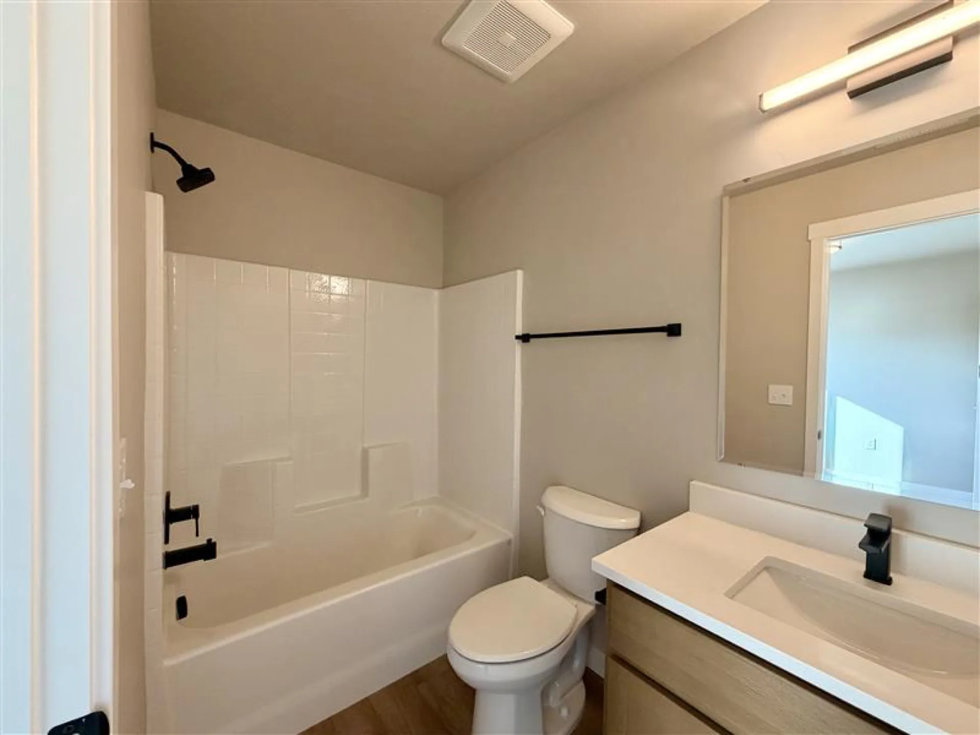 En-suite bathroom with walk-in shower and modern vanity in an Eagle Villa townhome