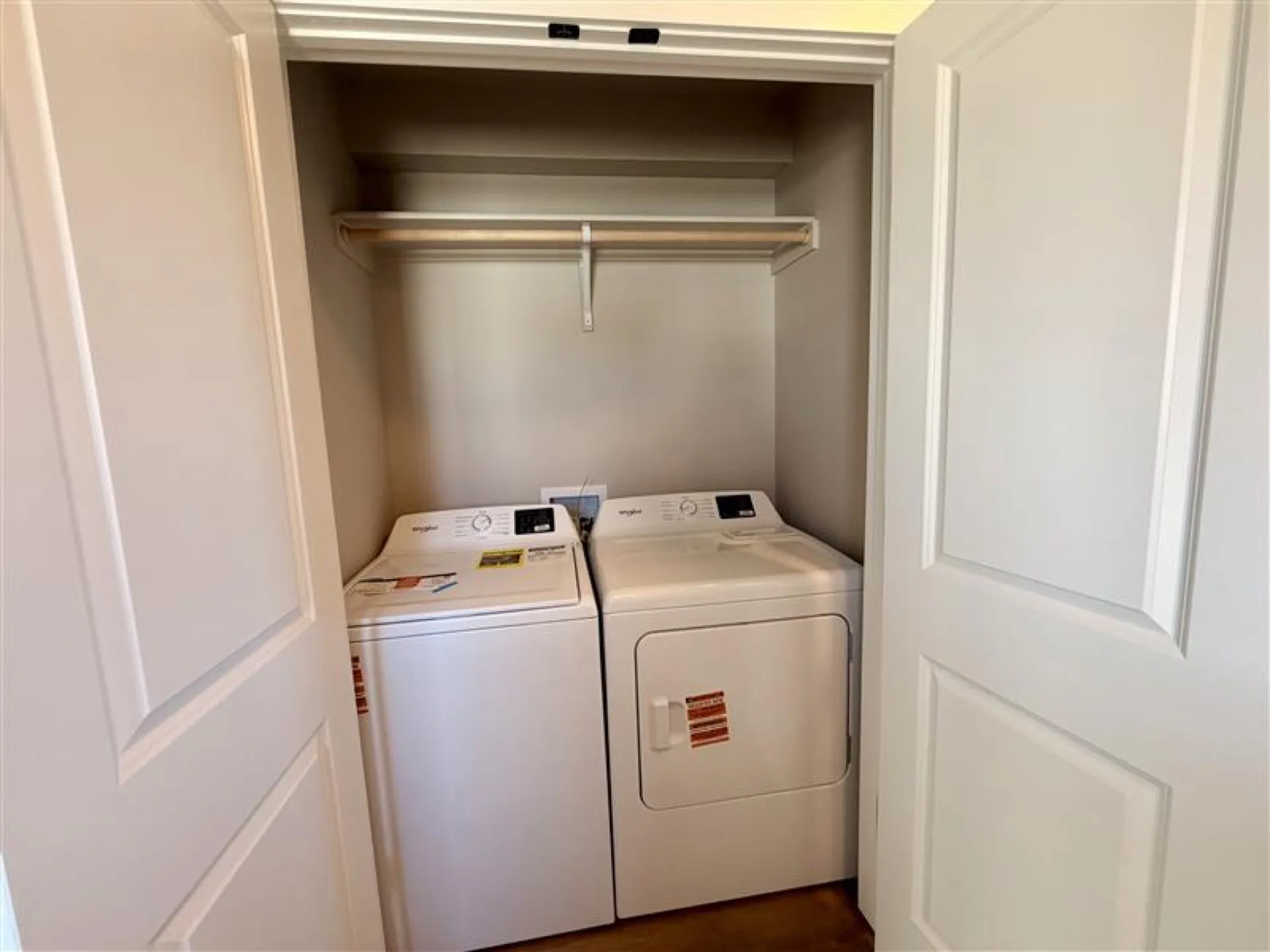 In-unit full-size white washer and dryer included in an Eagle Villa townhome rental