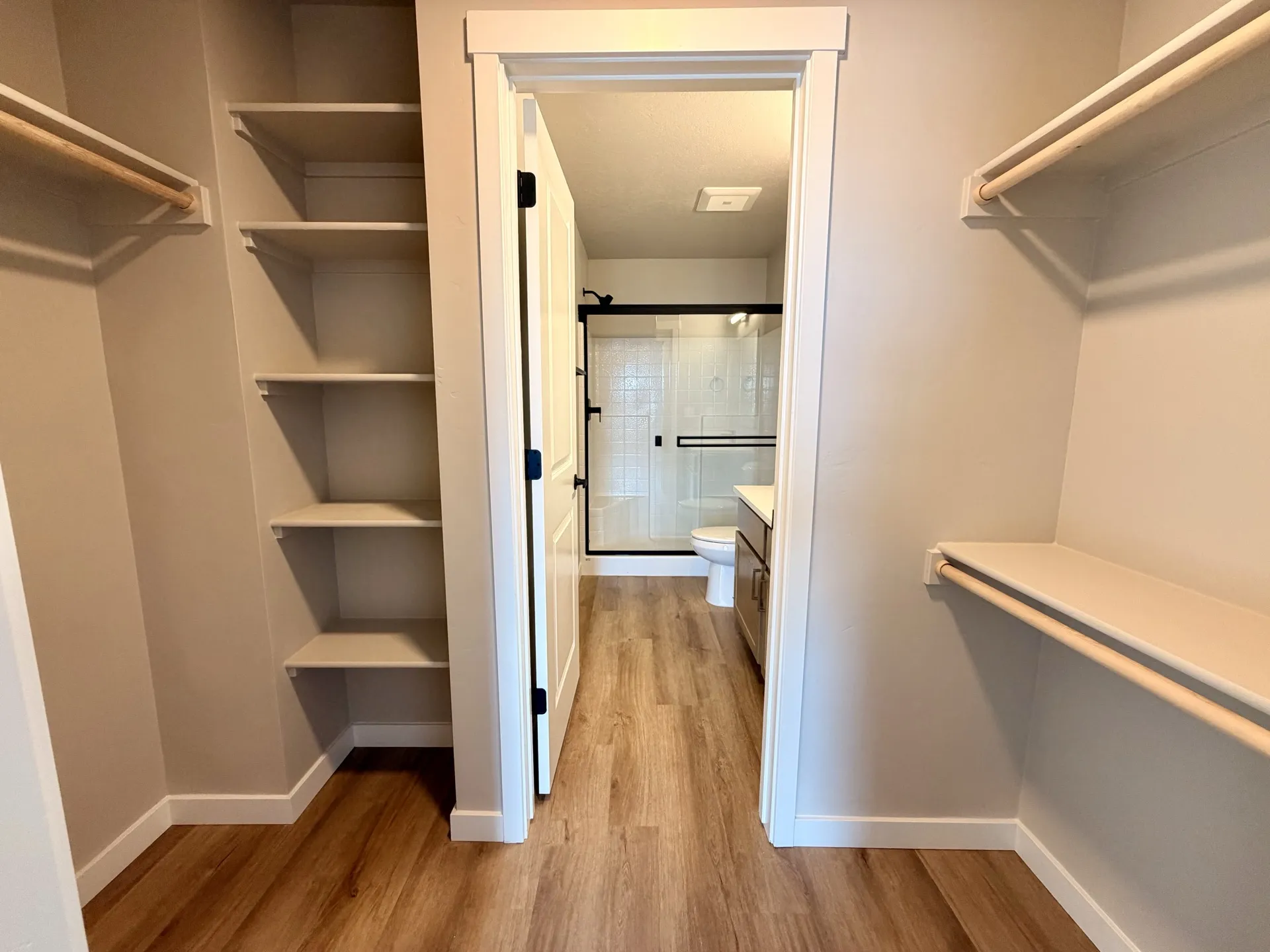 Spacious walk-in closet with custom shelving in a luxury Boise townhome rental